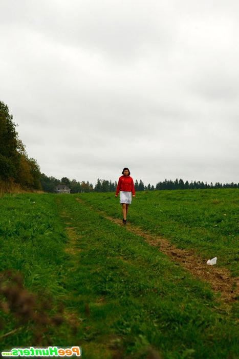 16P Barely legal brunette tinkling alone on a field
