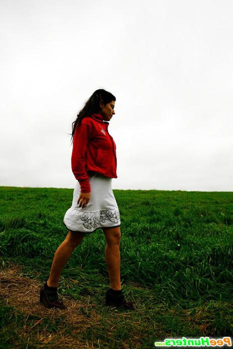 16P Barely legal brunette tinkling alone on a field