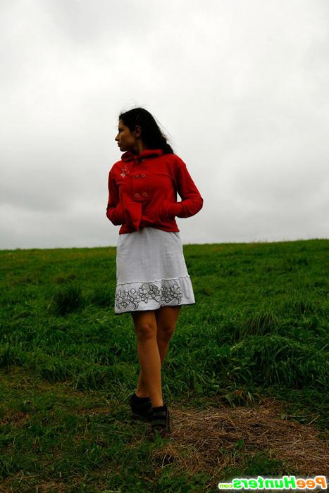16P Barely legal brunette tinkling alone on a field