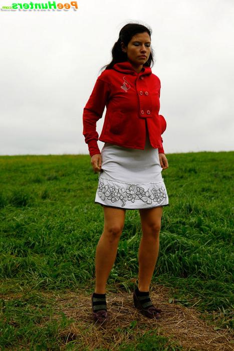 16P Barely legal brunette tinkling alone on a field