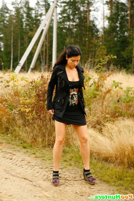 16P Beautiful brunette filmed pissing behind the bush