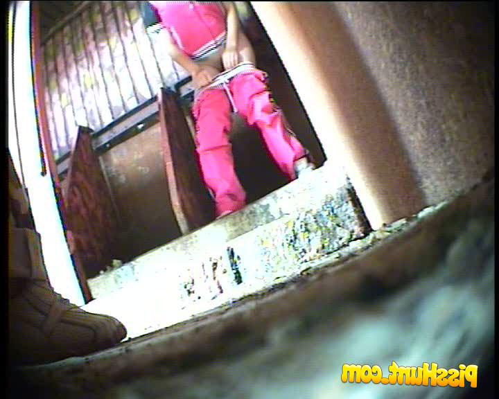 14P Two girls watering the spy cam planted in park loo 