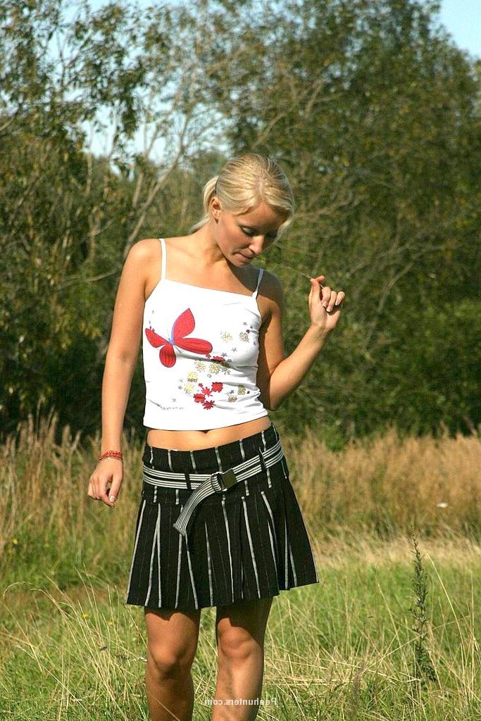 15P Yummy blonde teenie sits down and takes a piss outdoors