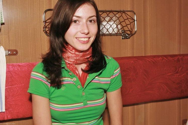 16P Young brunette lady peeing in the glass in front of the camera