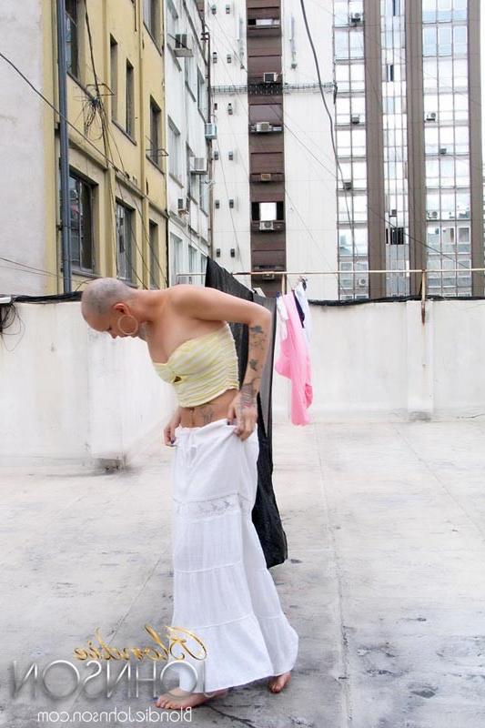 12P Bald shemale hanging clothes and stroking her shecock