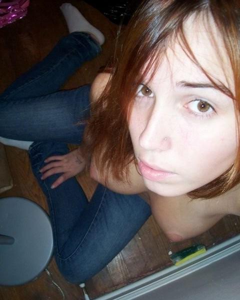 16P Selfshooting photos of naked redhead cutie spreading and posing