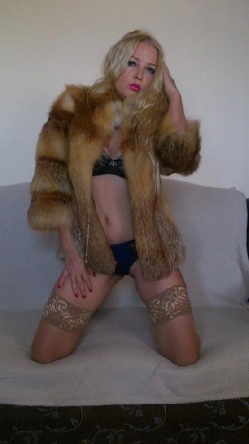 6P Blonde Russian posing on couch in shiny tan stockings