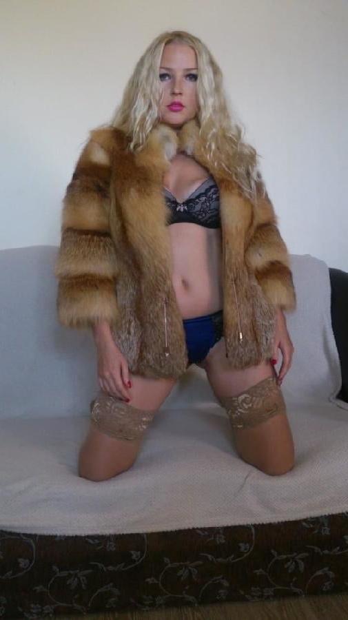 6P Blonde Russian posing on couch in shiny tan stockings