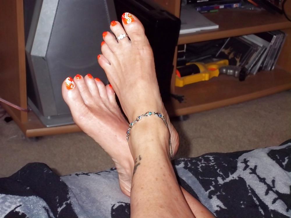 15P Chance's long tan legs and neon orange toes