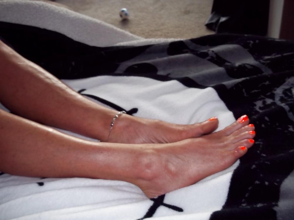 15P Chance's long tan legs and neon orange toes