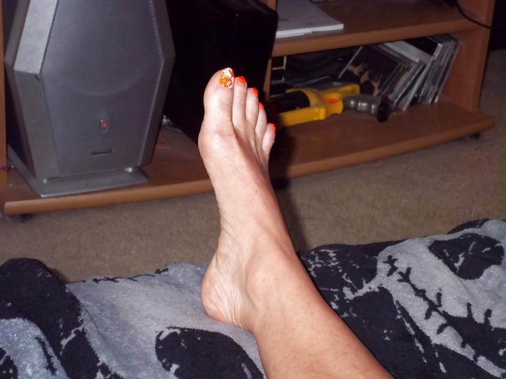 15P Chance's long tan legs and neon orange toes