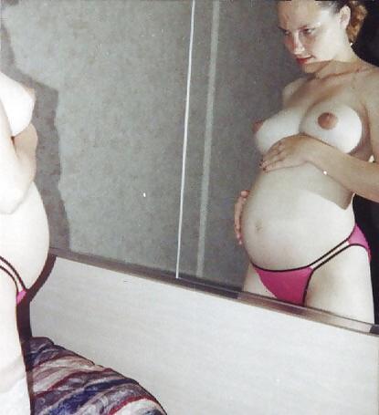 15P Pregnant blonde proudly showing her belly and boobs