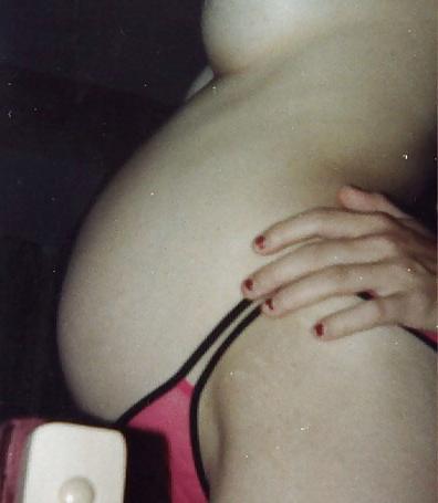 15P Pregnant blonde proudly showing her belly and boobs