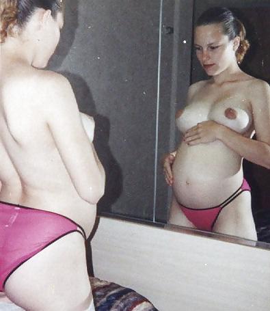 15P Pregnant blonde proudly showing her belly and boobs