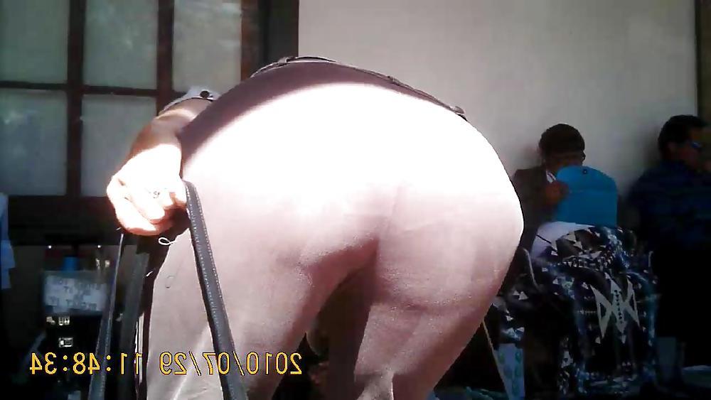 14P Mature Bending Over at a Market