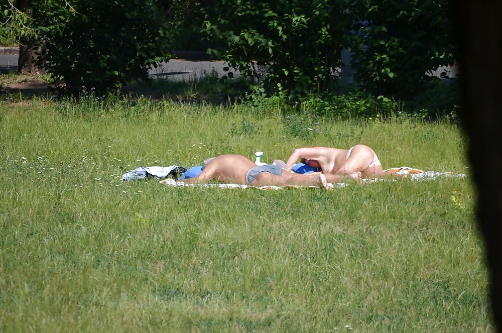 9P Girl sunbathing in the park 2