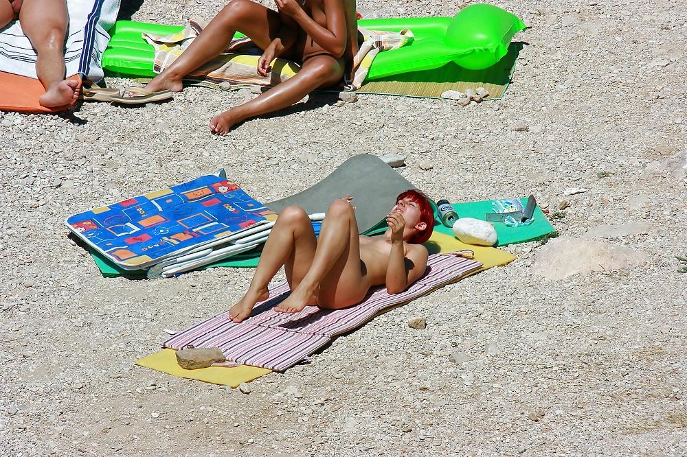 25P Hot redhead girl on naturist beach