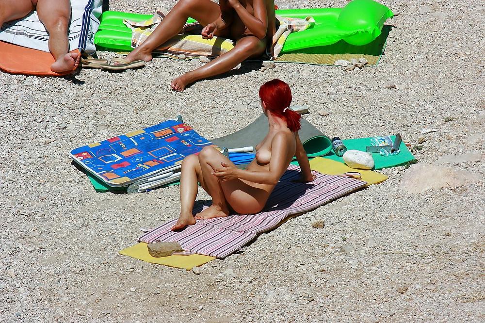 25P Hot redhead girl on naturist beach