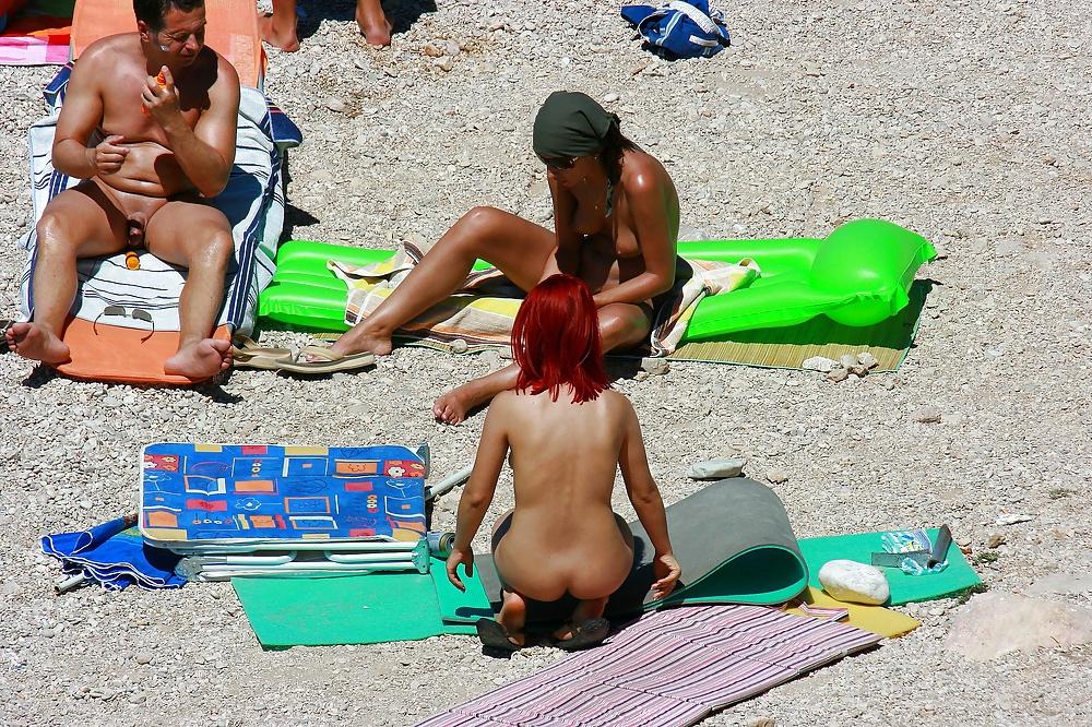 25P Hot redhead girl on naturist beach