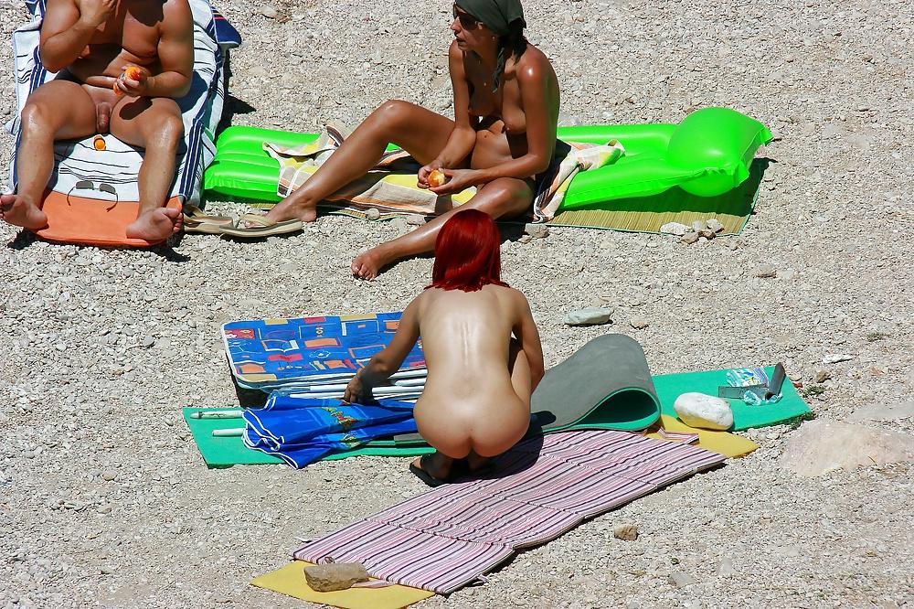 25P Hot redhead girl on naturist beach
