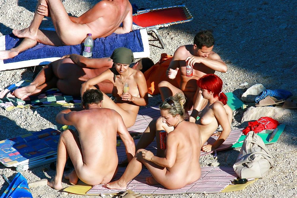 25P Hot redhead girl on naturist beach