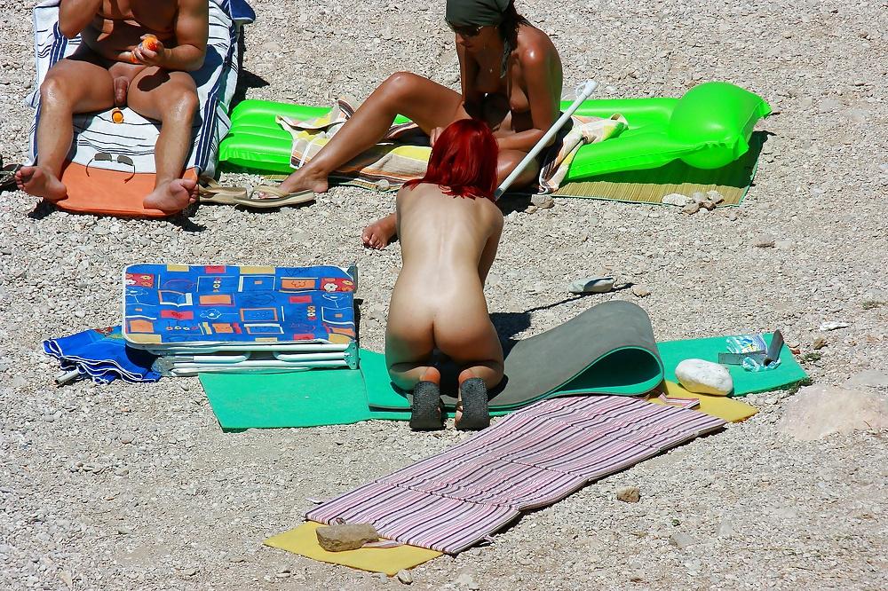 25P Hot redhead girl on naturist beach