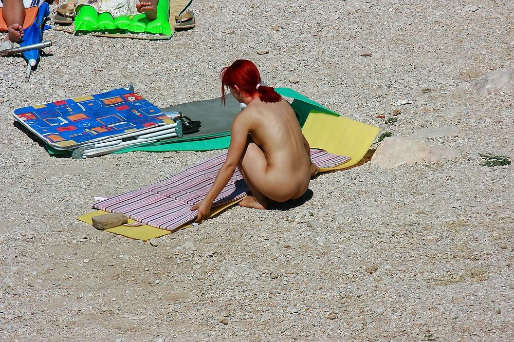 25P Hot redhead girl on naturist beach