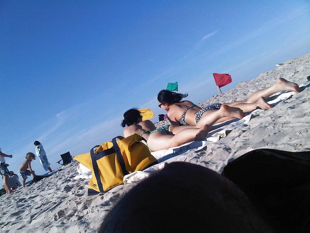 18P Asians laying on the beach