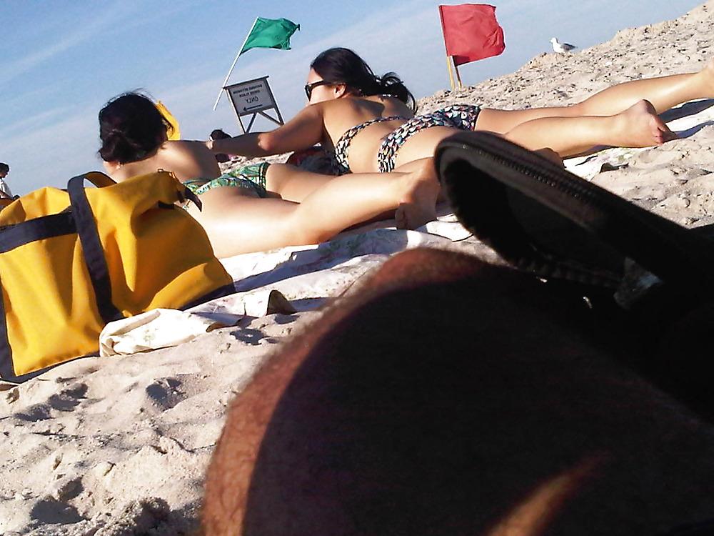 18P Asians laying on the beach