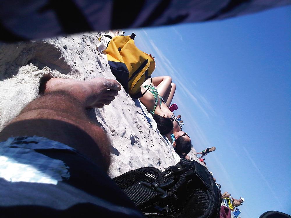 18P Asians laying on the beach