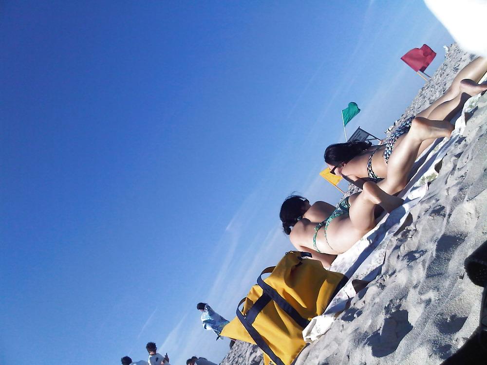 18P Asians laying on the beach