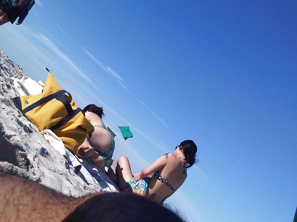 18P Asians laying on the beach