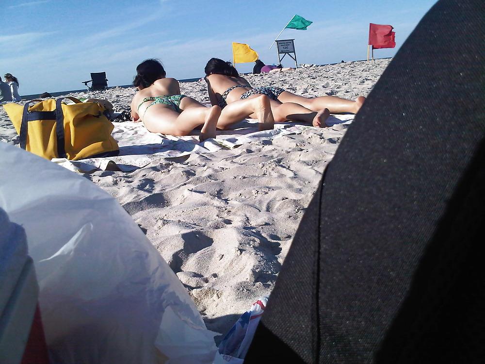 18P Asians laying on the beach