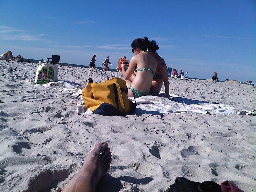 18P Asians laying on the beach