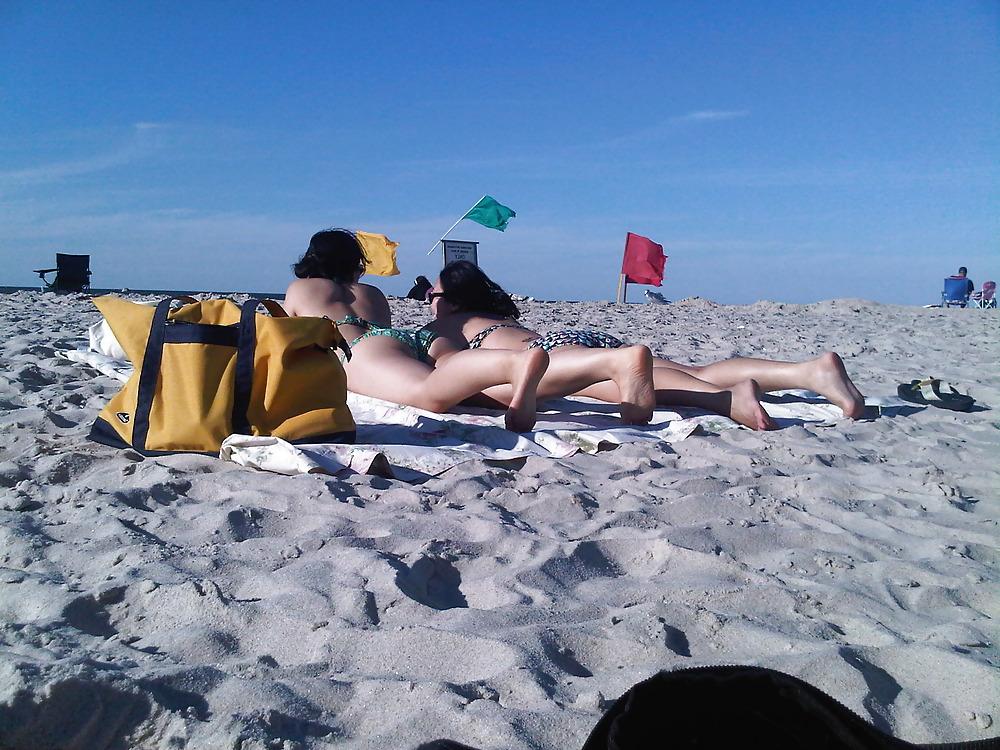 18P Asians laying on the beach