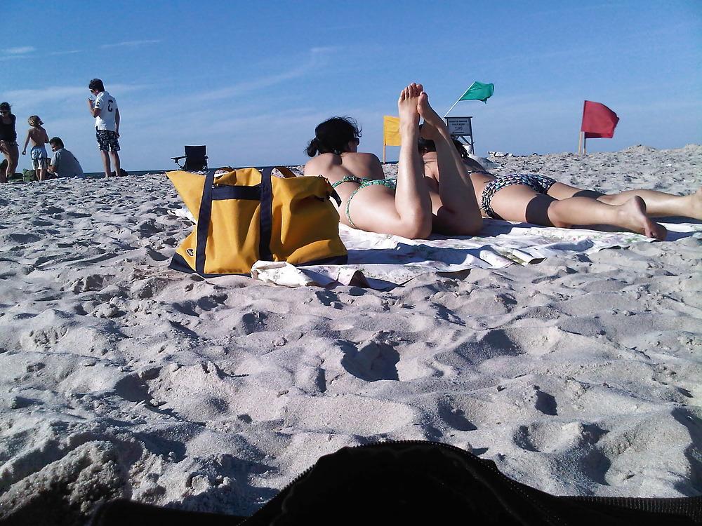 18P Asians laying on the beach