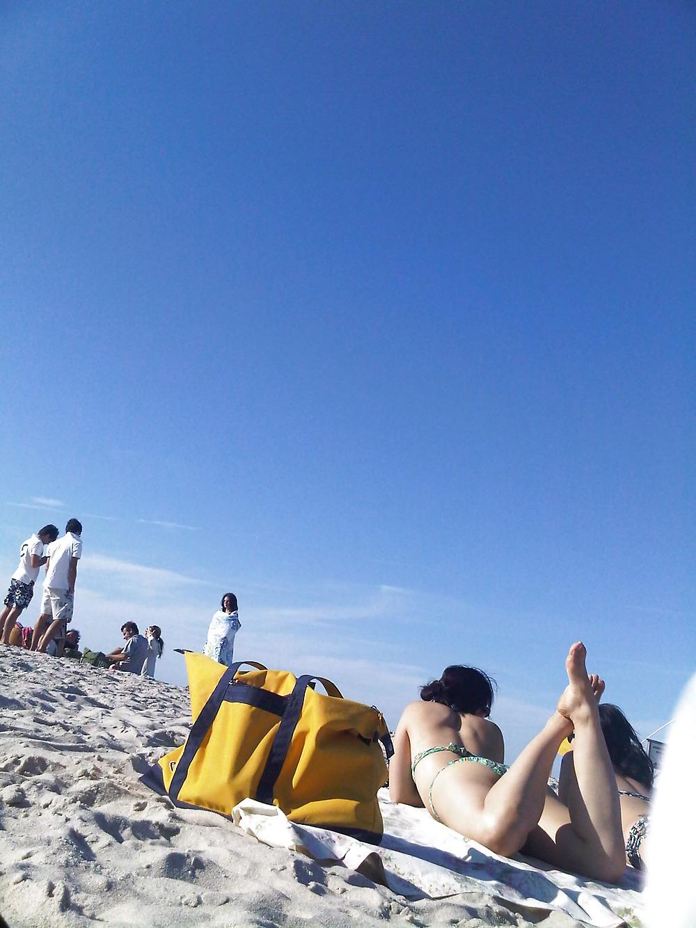 18P Asians laying on the beach