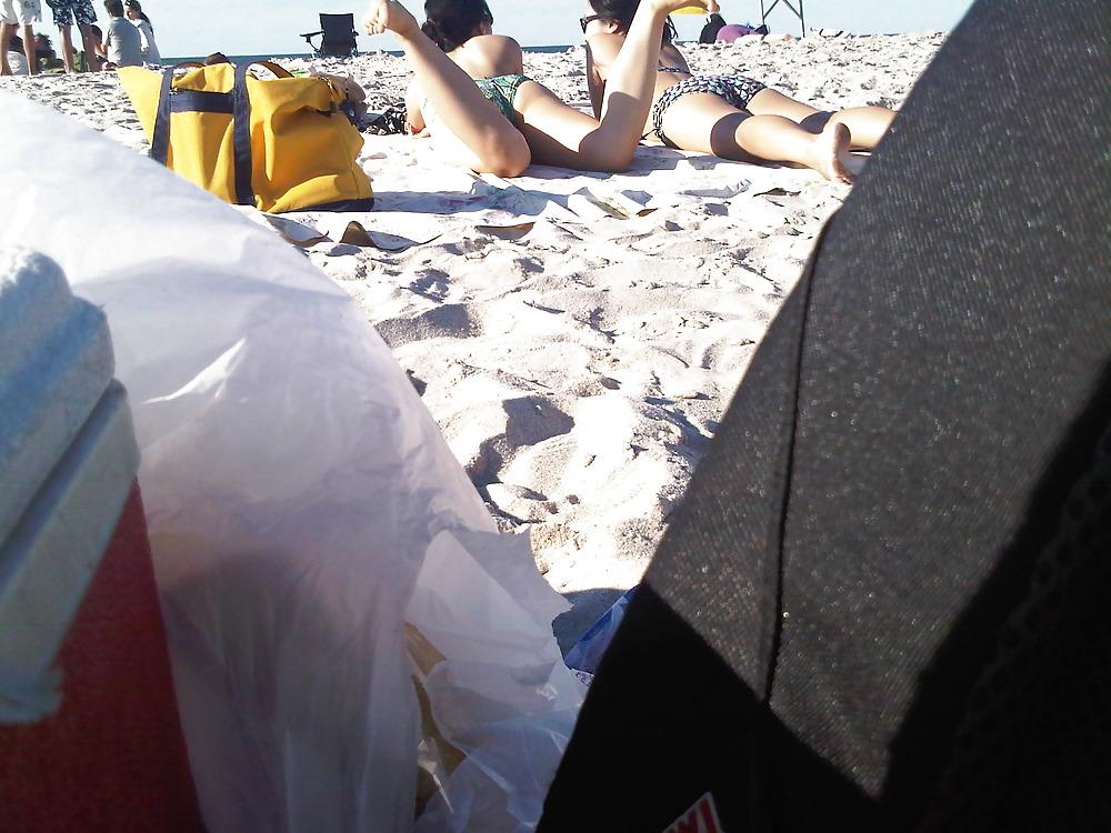 18P Asians laying on the beach