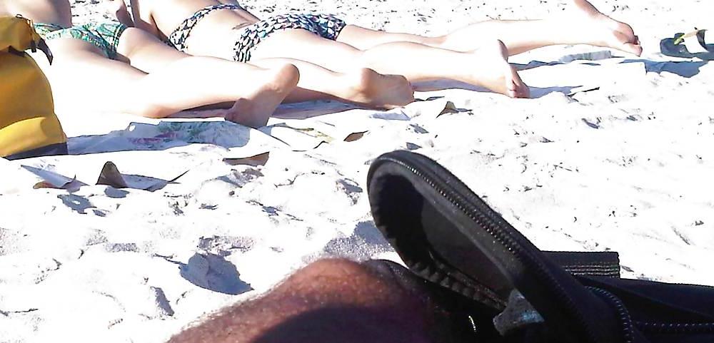 18P Asians laying on the beach