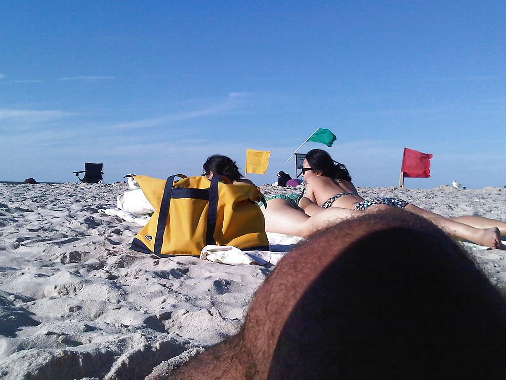 18P Asians laying on the beach