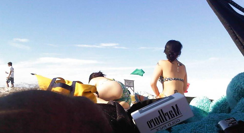 18P Asians laying on the beach