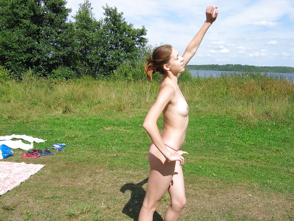 16P 2 Russian girls sunbathe the topless outdoors