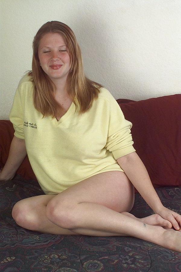 19P Busty pregnant blonde showing off her boobs and belly