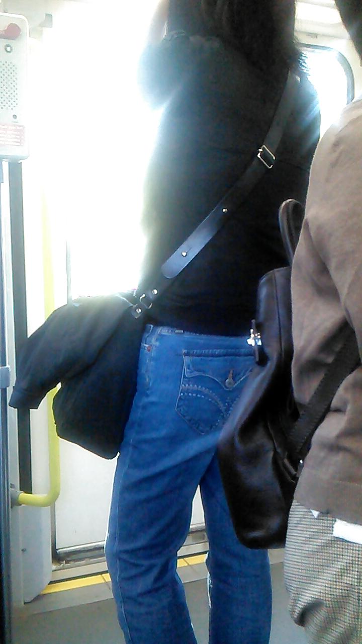 25P Voyeur - well-worn jeans and curves against the sun
