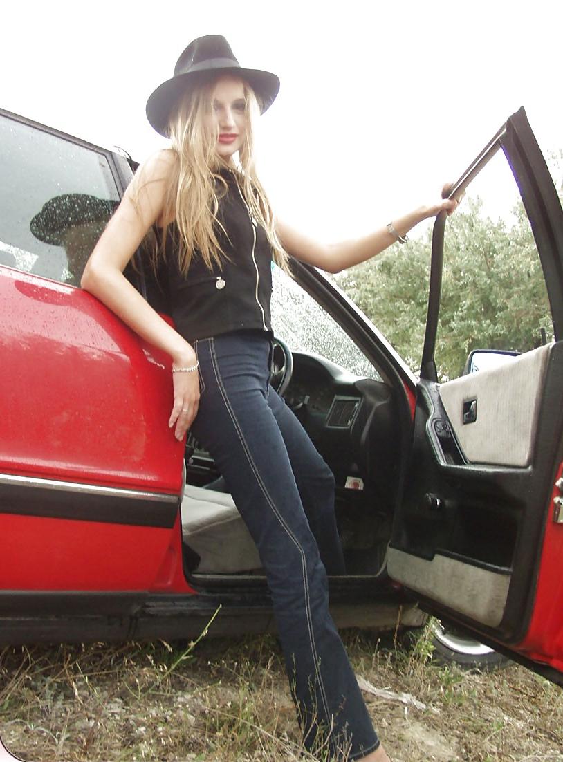 25P Blonde posing by her car