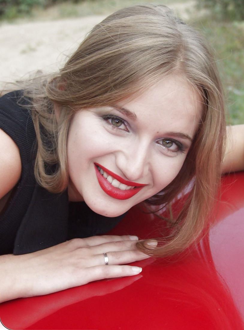 25P Blonde posing by her car