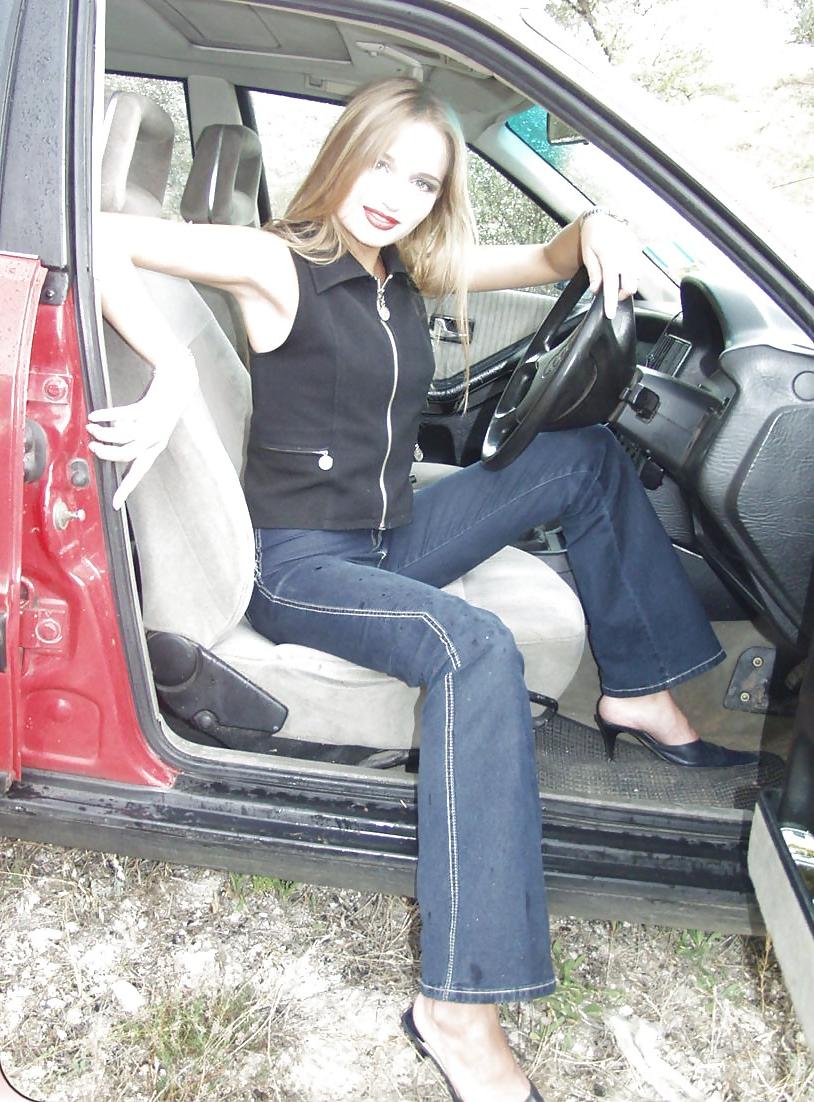 25P Blonde posing by her car