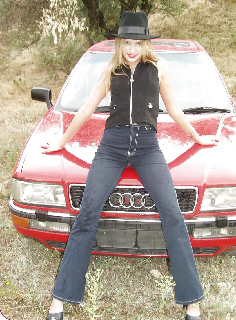 25P Blonde posing by her car
