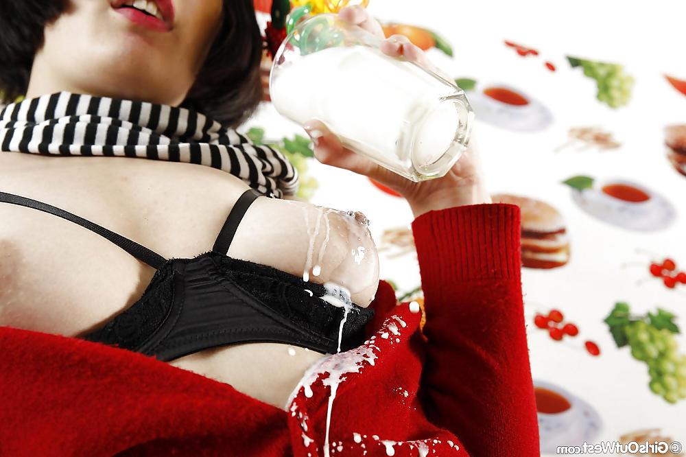 16P Brunette amateur chick spilling milk over her body
