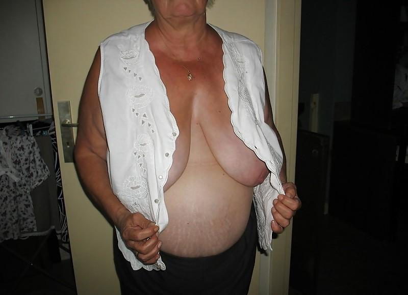 7P Housewife showing her big breasts